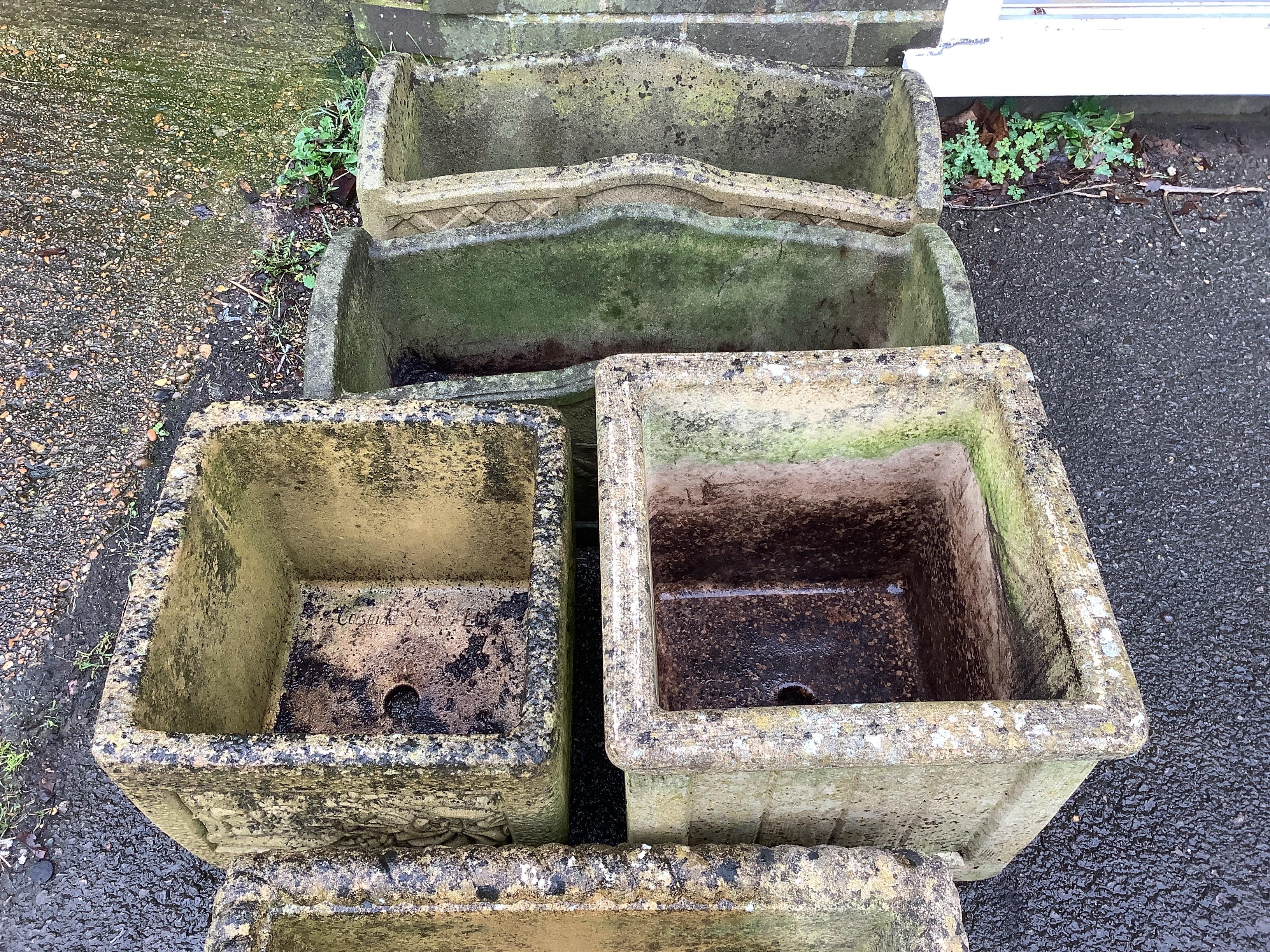 Two pairs of reconstituted stone rectangular garden planters, largest width 61cm, height 27cm and two others by Willowstone and Cotswold Stone